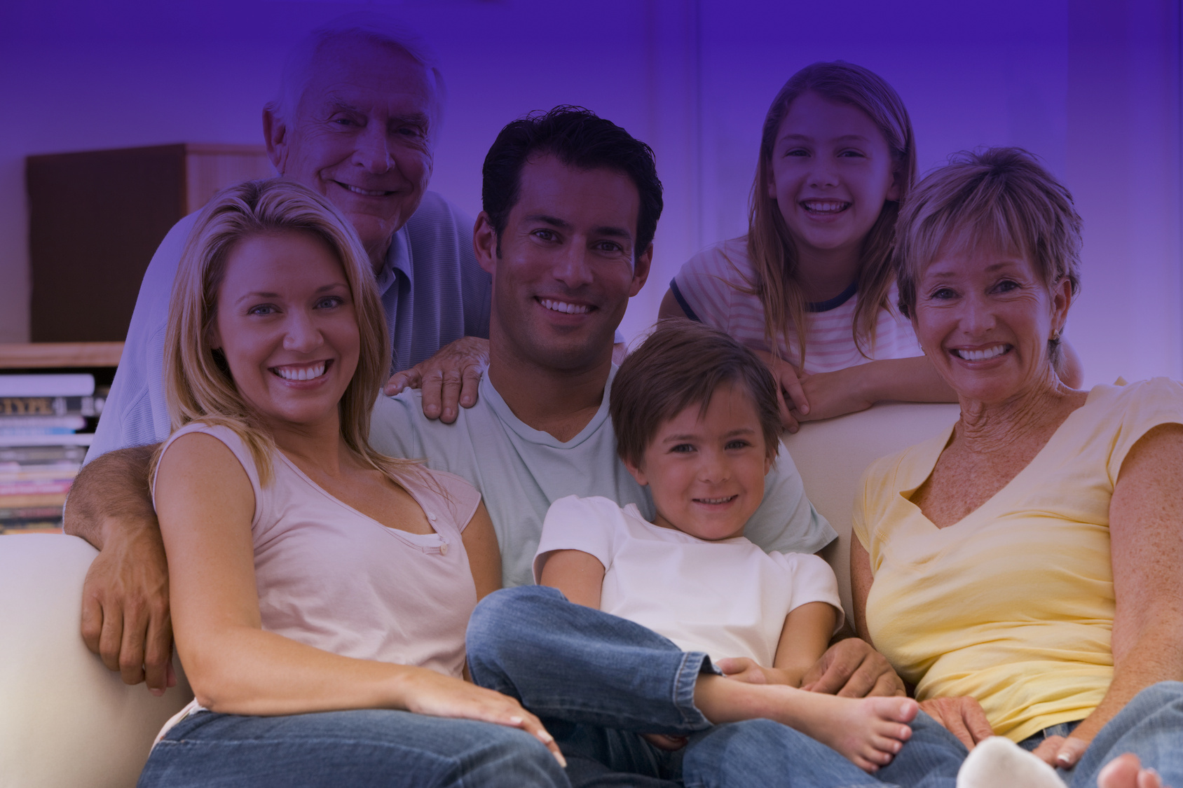 Extended family in living room smiling Dental Home Care